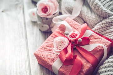Beautiful red gift box on wooden background