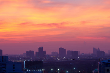 Fototapeta na wymiar Cityscape Lights And Purple blue Sky background at twilight time