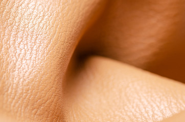 Beige yellow leather material fabric nature on blur background