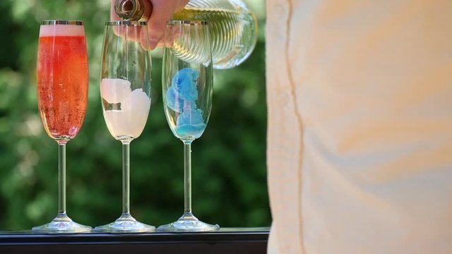 Pouring Champagne Into Glasses Of Italian Ice, Close Up