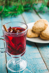 Christmas Mulled Wine with cookies on wooden background
