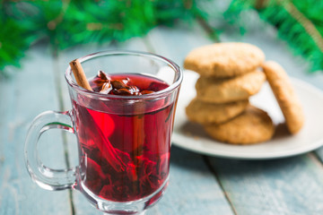 Christmas Mulled Wine with cookies on wooden background