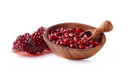 Cut the pomegranate with scattered grain  isolated on white background.