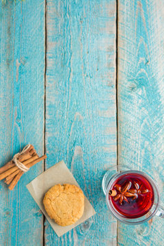 Christmas Mulled Wine with cookies on wooden background