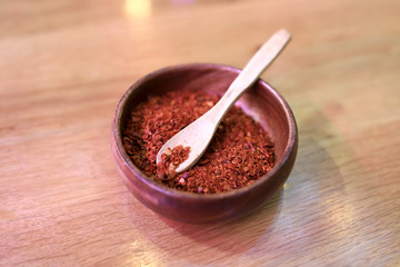 Red pepper in wooden cup