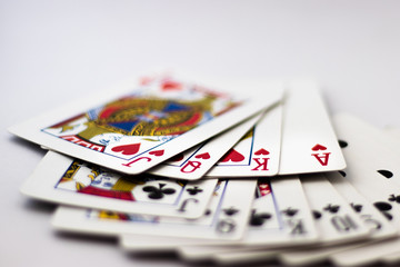 Queen, King, Jack, Ace from each Suit fanned out across back of cards, 