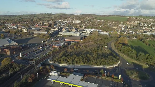 Aerial footage over the town of Bathgate in West Lothian, Scotland. Flying left. 
