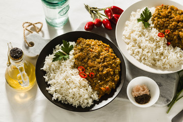 Basmati rice with curry from vegetables and lentils. Healthy spicy vegan food.