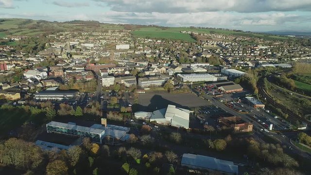 Aerial footage over the town of Bathgate in West Lothian, Scotland. Flying left. 
