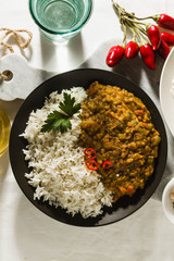 Basmati rice with curry from vegetables and lentils. Healthy spicy vegan food.