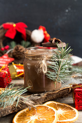 Jar of hot chocolate and Christmas decorations.