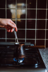 Cooking coffee on a gas stove.