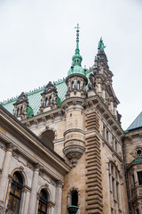 Hamburg City Hall building located in the Altstadt quarter in the city center at the Rathausmarkt square in a cold rainy early spring day