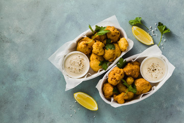 Fried cauliflower in batter with a savory sauce of cashew nuts. healthy vegan fast food. Baked Buffalo Cauliflower 