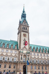 Fototapeta na wymiar Hamburg City Hall building located in the Altstadt quarter in the city center at the Rathausmarkt square in a cold rainy early spring day