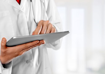 Close-up Doctor at hospital working with tablet pc