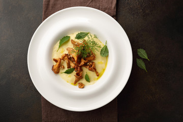 Italian polenta with chanterelle mushrooms top view