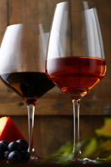 Two Wine glasses on wooden backdrop