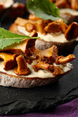 Bruschetta with cream cheese and mushrooms close-up