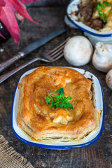 Steak and mushroom pie on rustic wooden backgournd