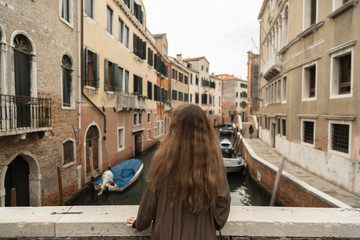 Fototapeta na wymiar Female standing and enjoying view of Venice