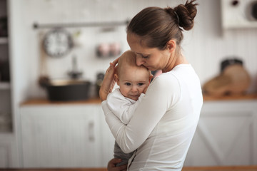 mom holds her son in her arms,comforts him