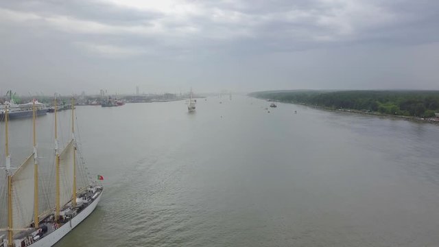 Aerial of Portuguese tall ship "Santa Maria Manuela" and Oman tall ship "Shabab Oman II" leaving port of Klaipeda during Tall Ships Races 2017