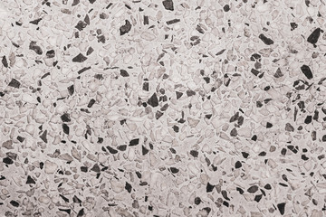 Grober Beton mit Steinen als Hintergrund - Textur