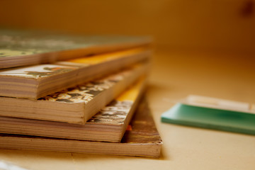 Text Books and pencils on wooden table