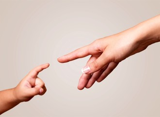 Child and adult human hands isolated on