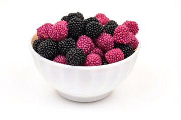 Fruit jelly in the form of berries on a white background.