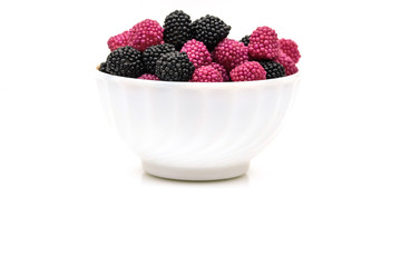 Fruit jelly in the form of berries on a white background.