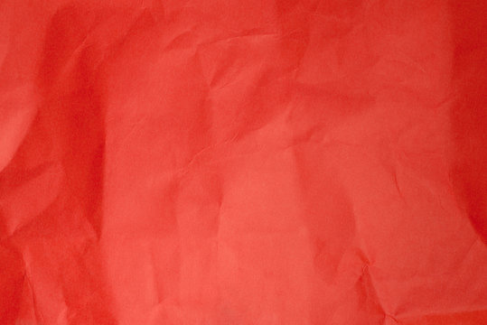 creased red paper backgrund texture