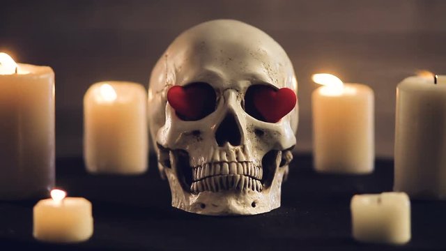 Magic ritual with skull and hearts