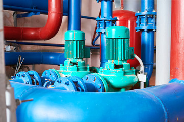 Blue engine with a pump connected to the blue pipes.