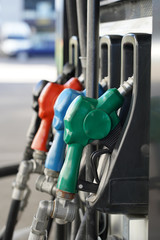 Petrol pump filling nozzles. Fuel at gas station close up
