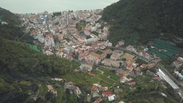 Tilt up aerial, lush town of Maiori