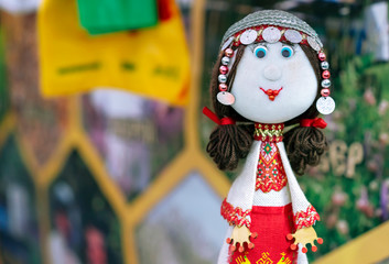 A doll in the national Chuvash costume and in headdress with coins.
