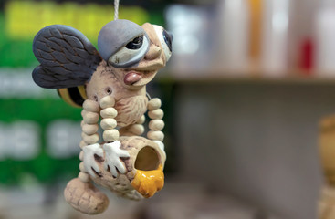Ceramic bee figurine in a honey store.