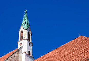 Fototapeta na wymiar Latvia. St John's Church steeple in Riga