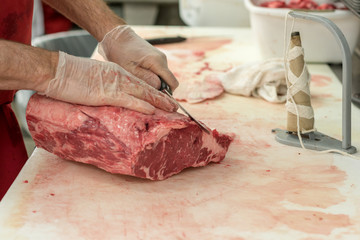 Butcher Carving Meat - 230874850