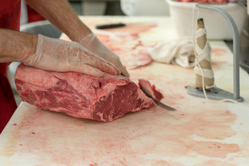 Butcher Carving Meat - 230874854
