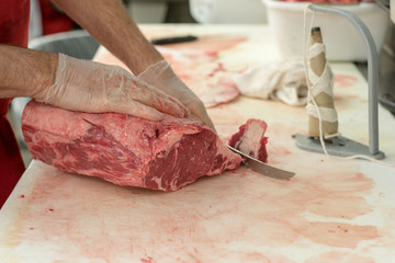 Butcher Carving Meat - 230874878