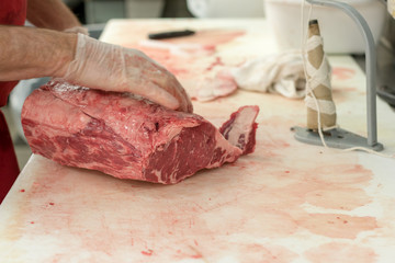 Butcher Carving Meat - 230874881
