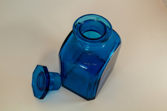 old glass medical container made of dark blue glass