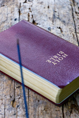 Incense and Bible in the forest - 230875240