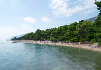 Beautiful beach with people on the Mediterranean sea.