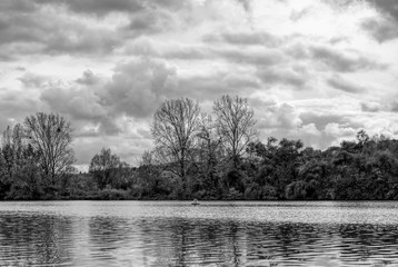 River Main in Lower Franconia, Bavaria in autumn with dramatic sky, Black and white