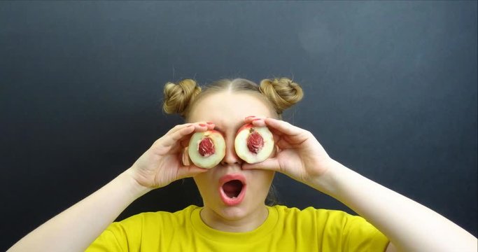  Beautiful girl with fruits on eyes stop motion loop