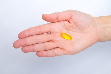 Nutrition. Healthy Lifestyle. Woman Holding Capsule With Fish Oil Omega-3. Supplements, Vitamins.